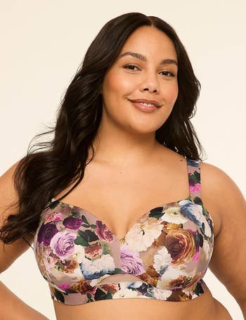 Person smiling, wearing a floral-patterned bra. Featured successful a buying article