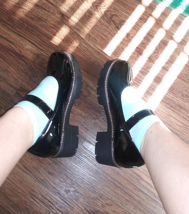 reviewer photo of them wearing the low-heel mary janes with white ankle socks
