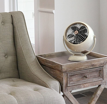 the white fan on an end table