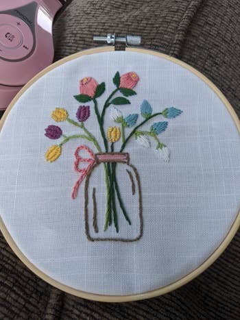 embroidery with flowers in a vase