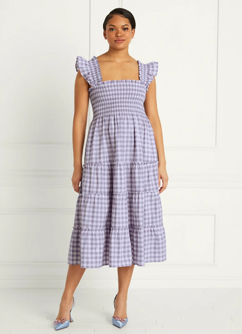 model wearing the purple and white gingham dress