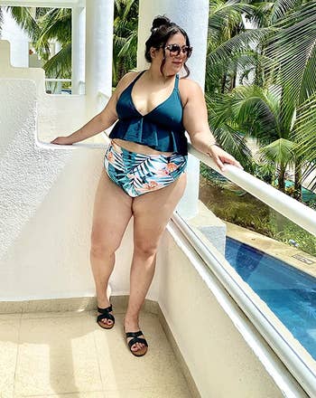 reviewer wearing the bathing suit with black sandals