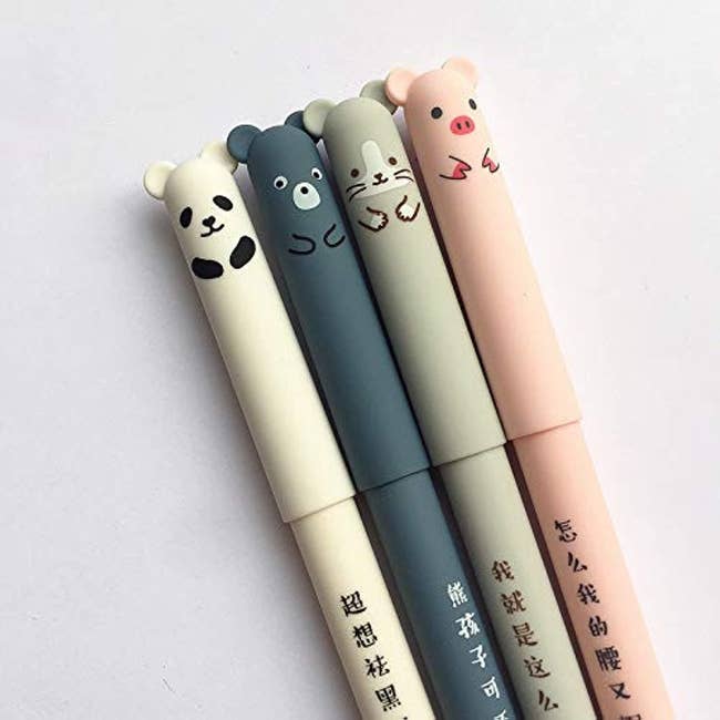 pens shaped like a panda, mouse, bear, and pig