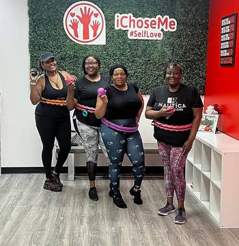 image of four people with weighted hoops around their waists