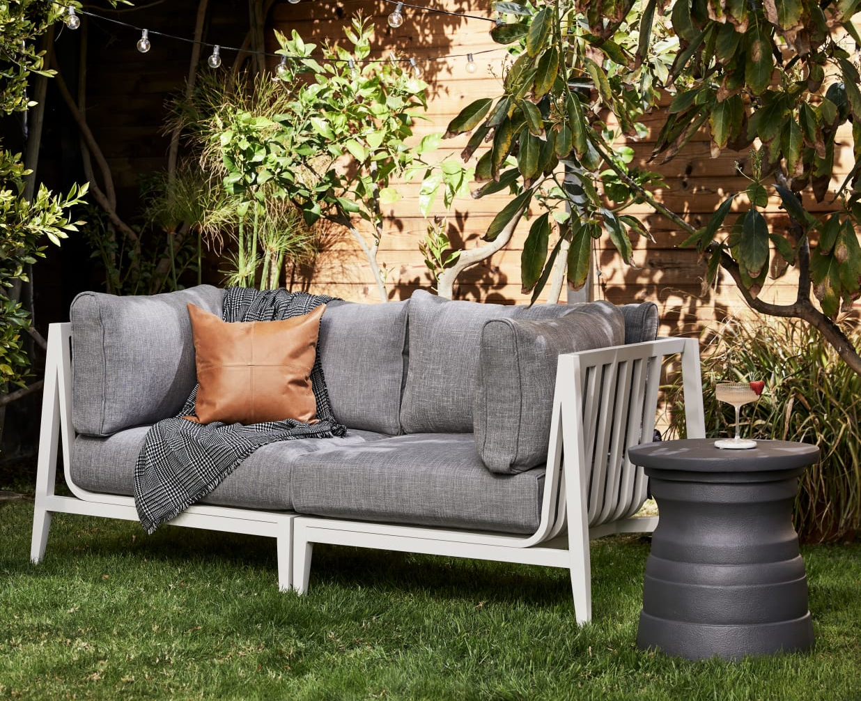 the white aluminum and grey loveseat