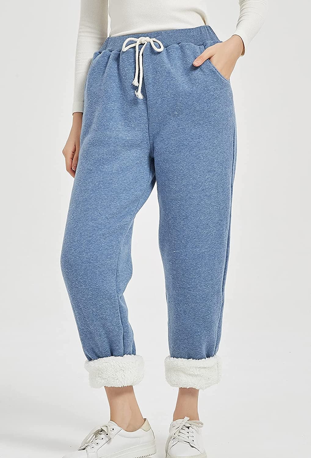 close up of model wearing the blue sweatpants