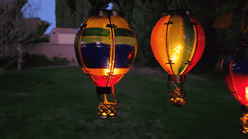 a gif of the three hot air balloons with flickering solar lights in them