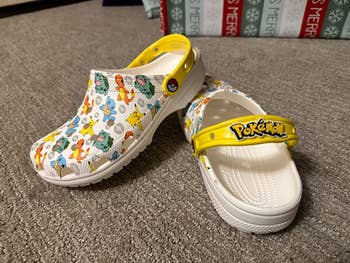 a reviewer's crocs with pokemon on them
