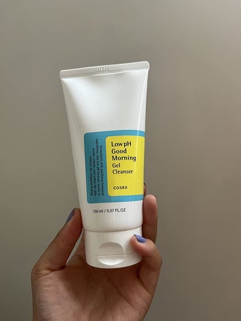reviewer holding bottle of low ph gel