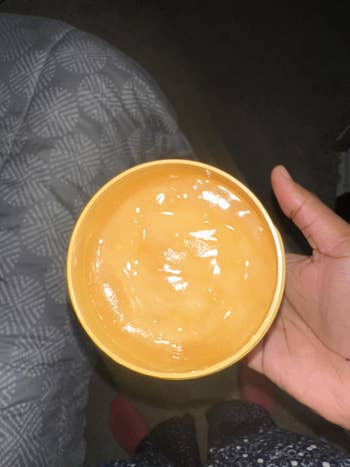 Person holding a jar of tub o butter