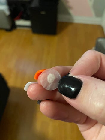 Reviewer holding patch with gunk