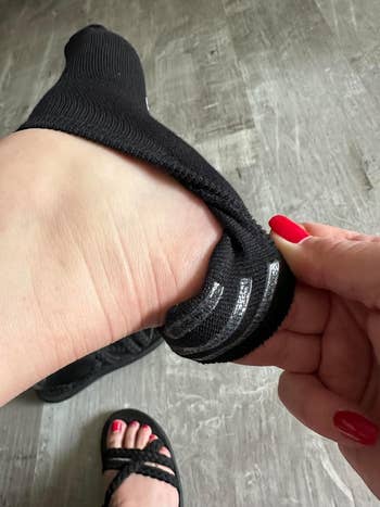 reviewer showing silicone strips connected no-show socks