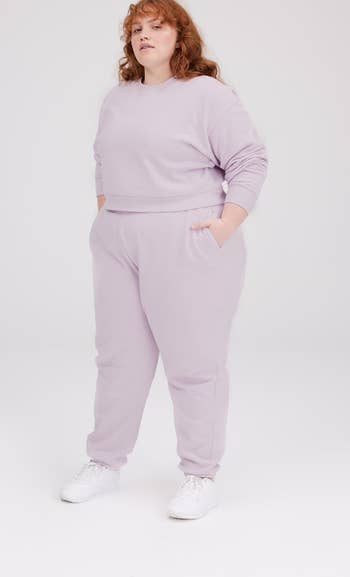 a model wearing the lavender joggers with a matching top