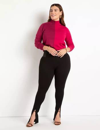 model wearing the pink and maroon turtleneck with black pants and heels