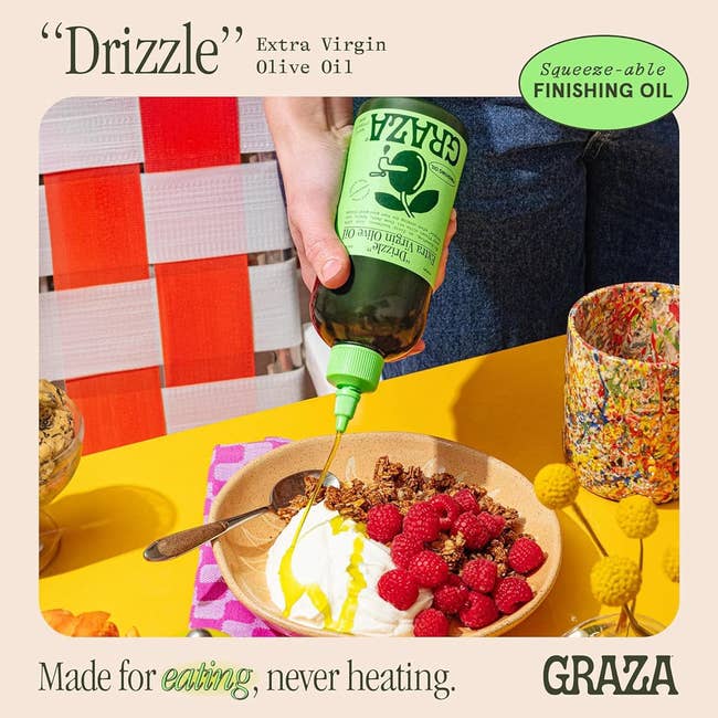 Person pouring other virgin olive lipid implicit yogurt, granola, and raspberries from a squeezable Graza bottle. Text highlights merchandise arsenic a finishing oil