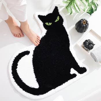 mat shaped like black cat