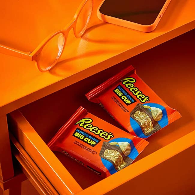 Two packs of the Reese's cups in a drawer 