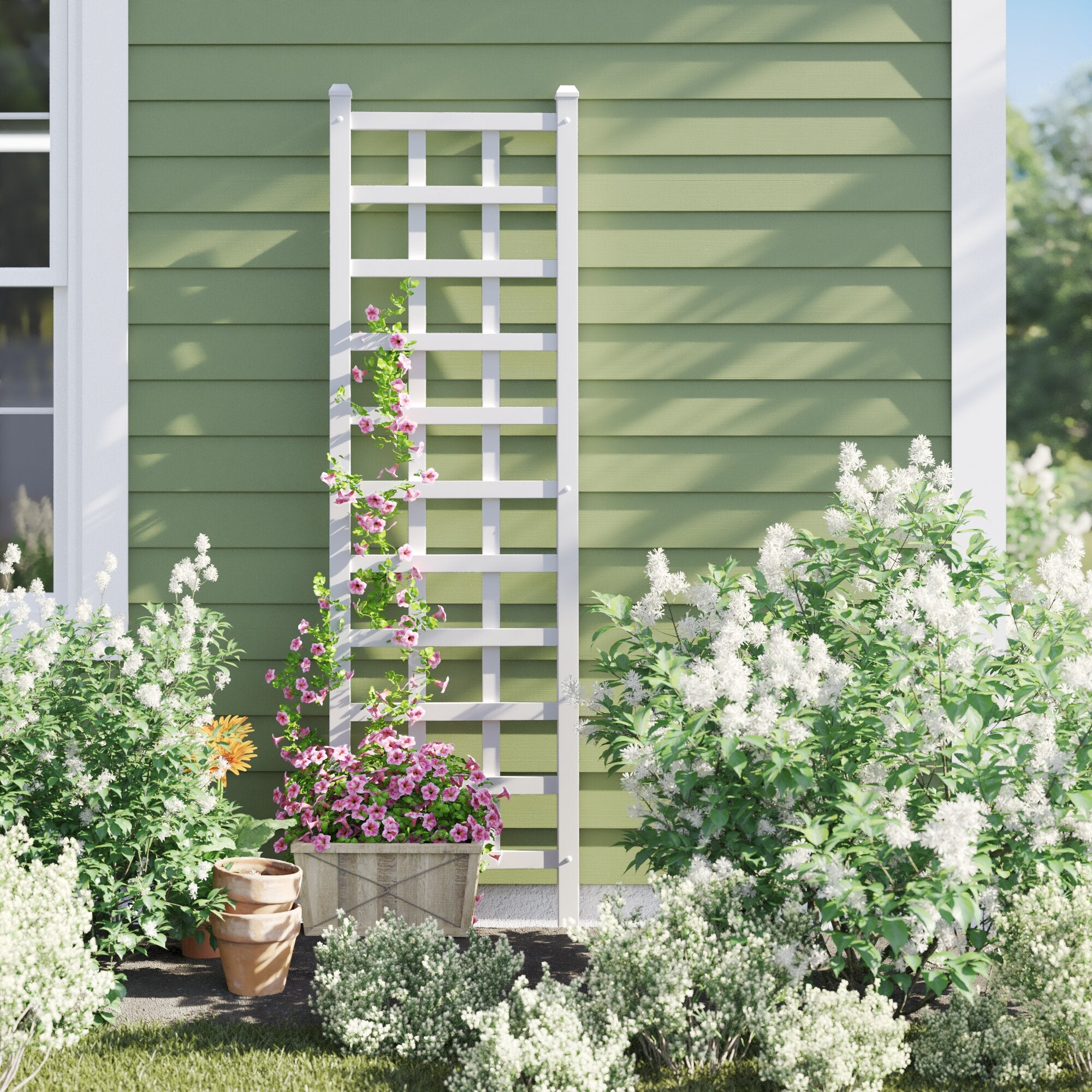 vertical white PVC trellis leaning up against house