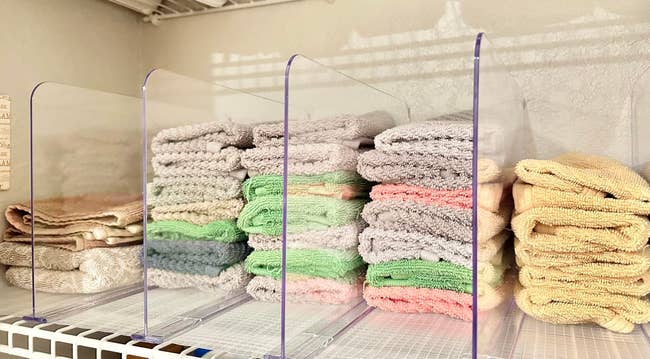 Neatly folded towels with support divider betwixt the