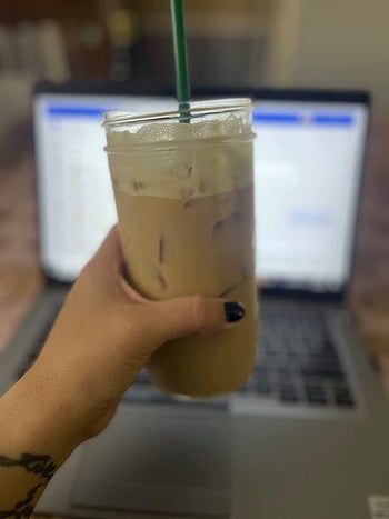 another reviewer holding iced coffee made from the hyperchiller