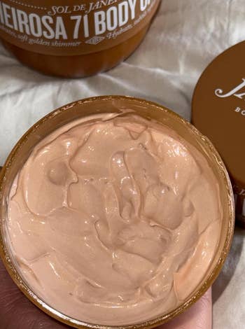 Open jar of assemblage  pick  with a smooth, whipped texture, labeled Sol de Janeiro