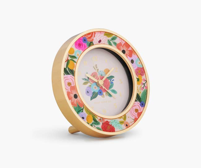 a small circular floral desk clock