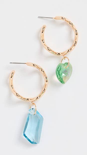 gold hoops one with green crystal heart and one with blue crystal