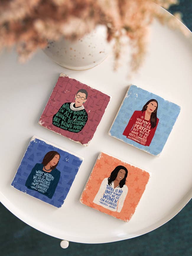 four coasters with the illustrated likeness of ruth bader ginsberg, Alexandria Ocasio-Cortez, Kamala Harris, and Michelle Obama