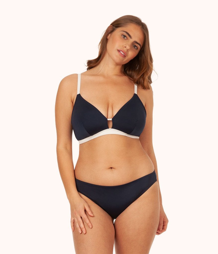 model wearing the navy and white bikini top
