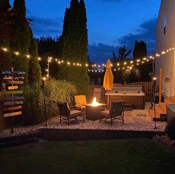 reviewer's backyard space decorate with the string lights