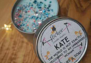 the lid with the same quote and print and the top of the candle with teal and pink glitter