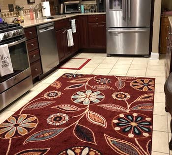 Reviewer image of the red floral rug in the kichen