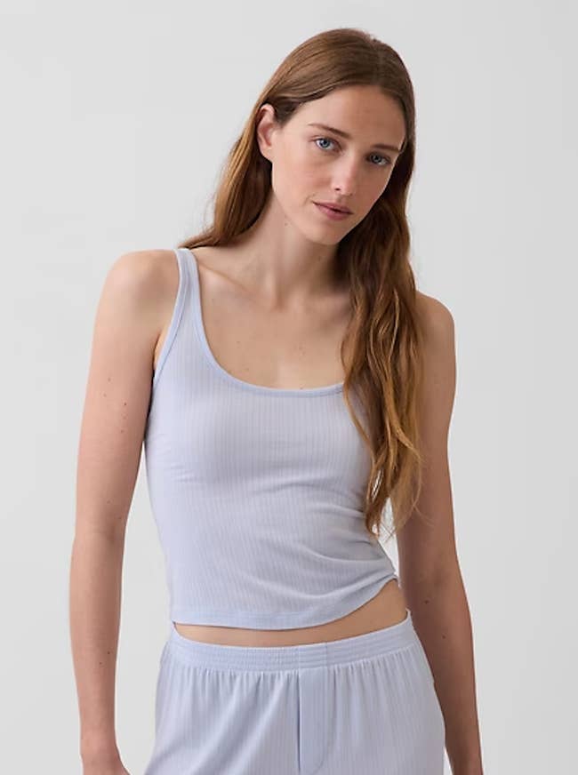 Person wearing a casual, ribbed vessel apical and shorts set. The outfit appears comfy and suitable for lounging oregon sleepwear