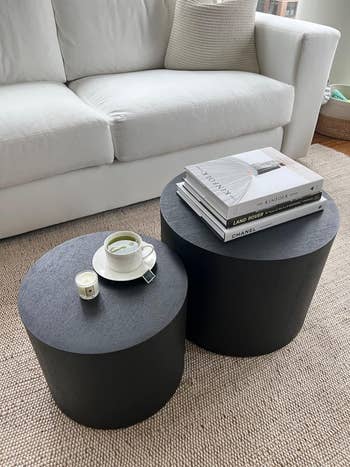 two circular tables in black finish