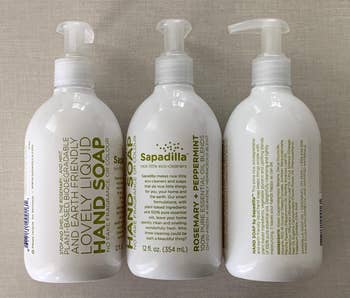Reviewer image of three green and white bottles of hand soap