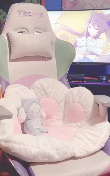 Gaming chair with plush paw cushion