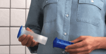 gif of person using the gel stamp on toilet bowl
