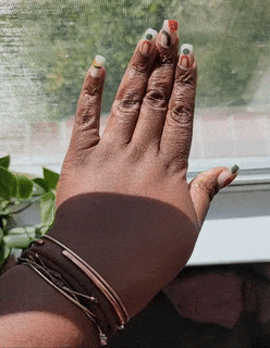 gif of reviewer showing off nails