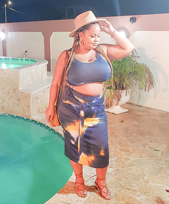 reviewer wearing the navy and orange tie-dye set