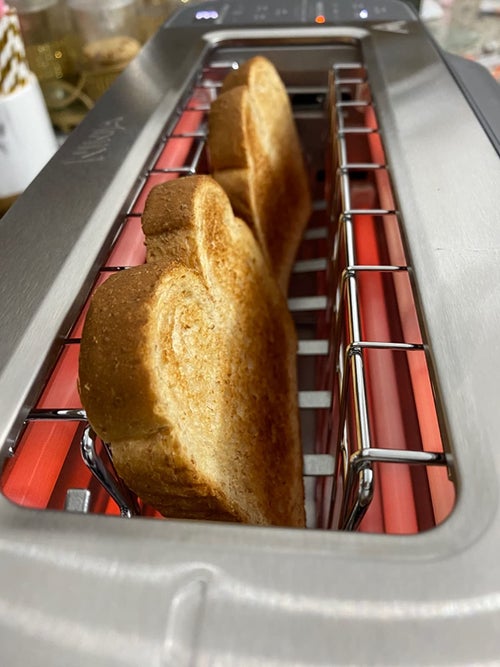 A reviewer making toast in their toaster