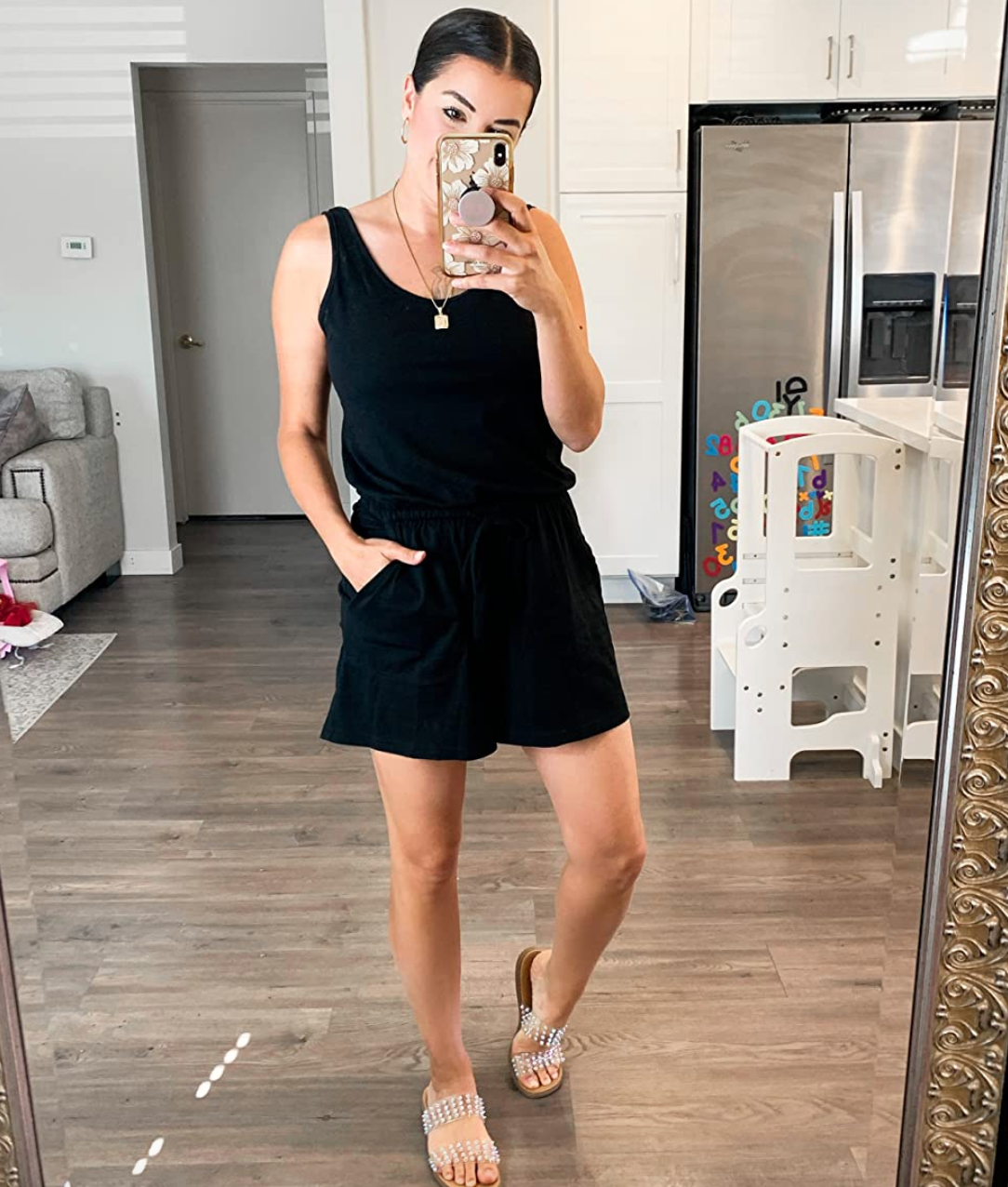 reviewer wearing the black romper