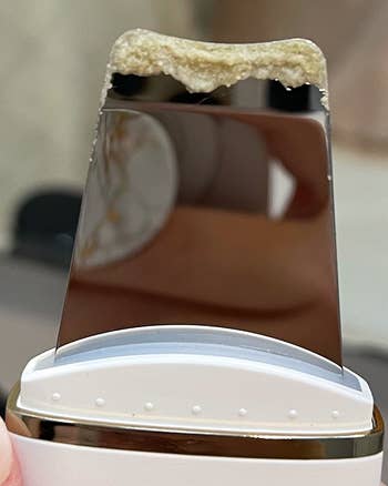 Reviewer's skin spatula with all of the gunk and sebum removed from their skin