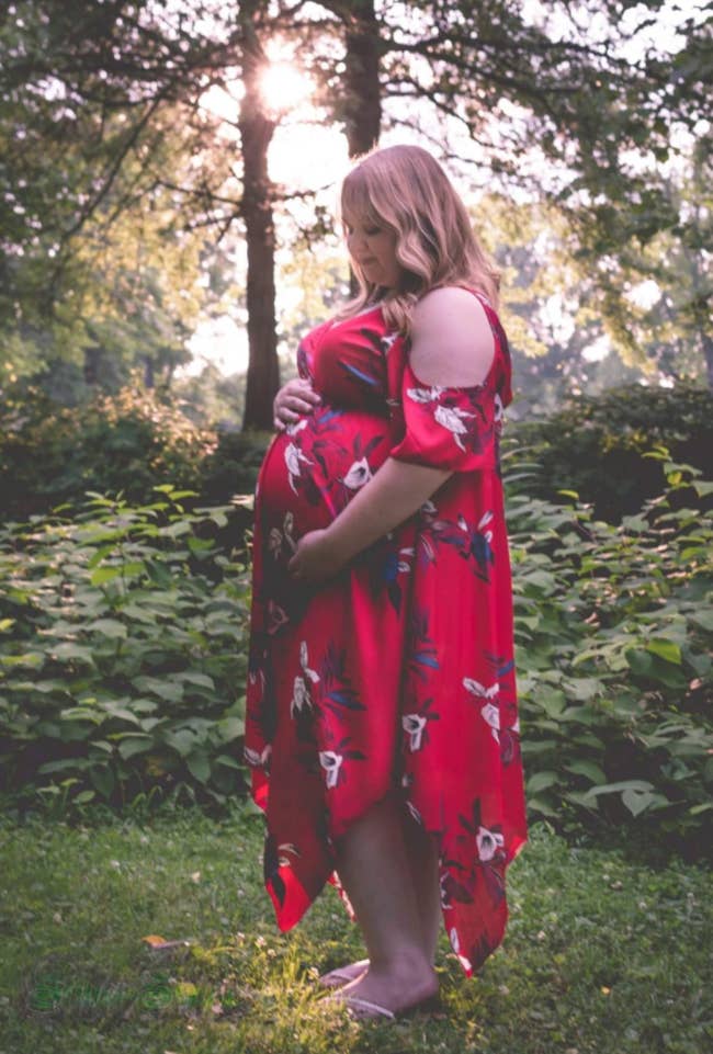 A reviewer wearing the dress in their maternity photos