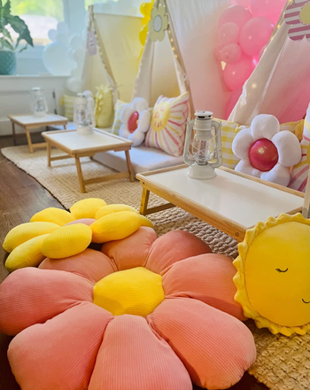 oversized pink and yellow versions on the floor of a child's bedroom 