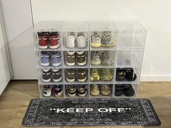reviewer photo of stack of clear shoe boxes with sneakers inside