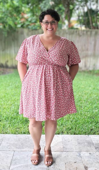 a reviewer in the pink floral dress