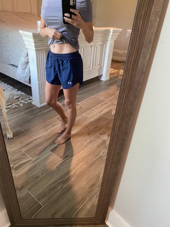 a different reviewer wearing blue shorts