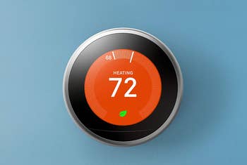 nest thermostat on a wall