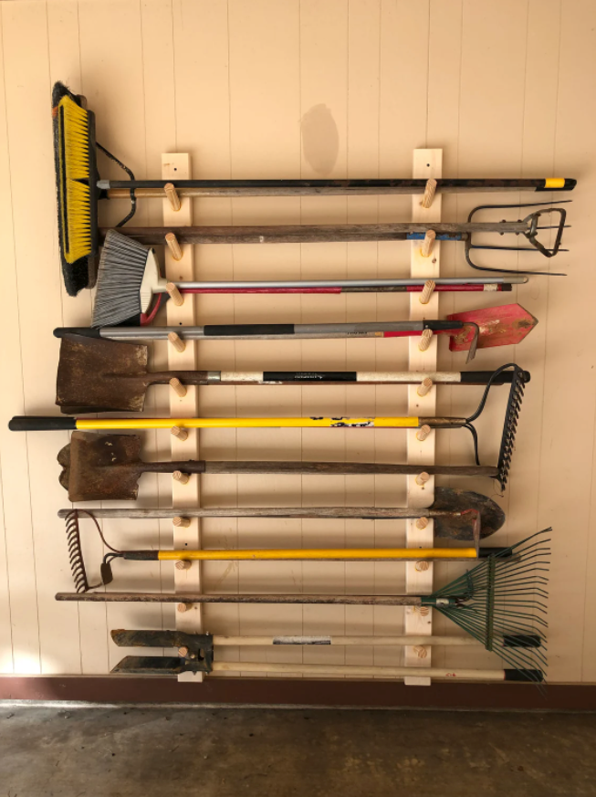 tools organized on the wooden storage hooks