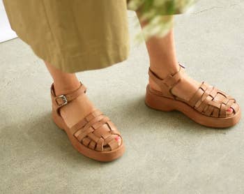 model wearing the sandals in tan